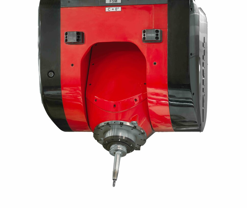  A precise mechanical machining unit in the tool manufacturing industry. The image shows the head of a state-of-the-art milling machine with a robust tool holder. The machine features a red and black casing and is designed to process workpieces with the highest accuracy. This is a typical example of advanced mechanical machining in tool manufacturing, particularly in the automotive industry.